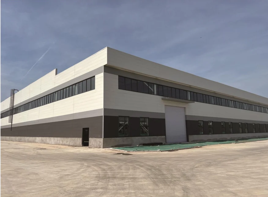 Light and dark cladding on an industrial building exterior
