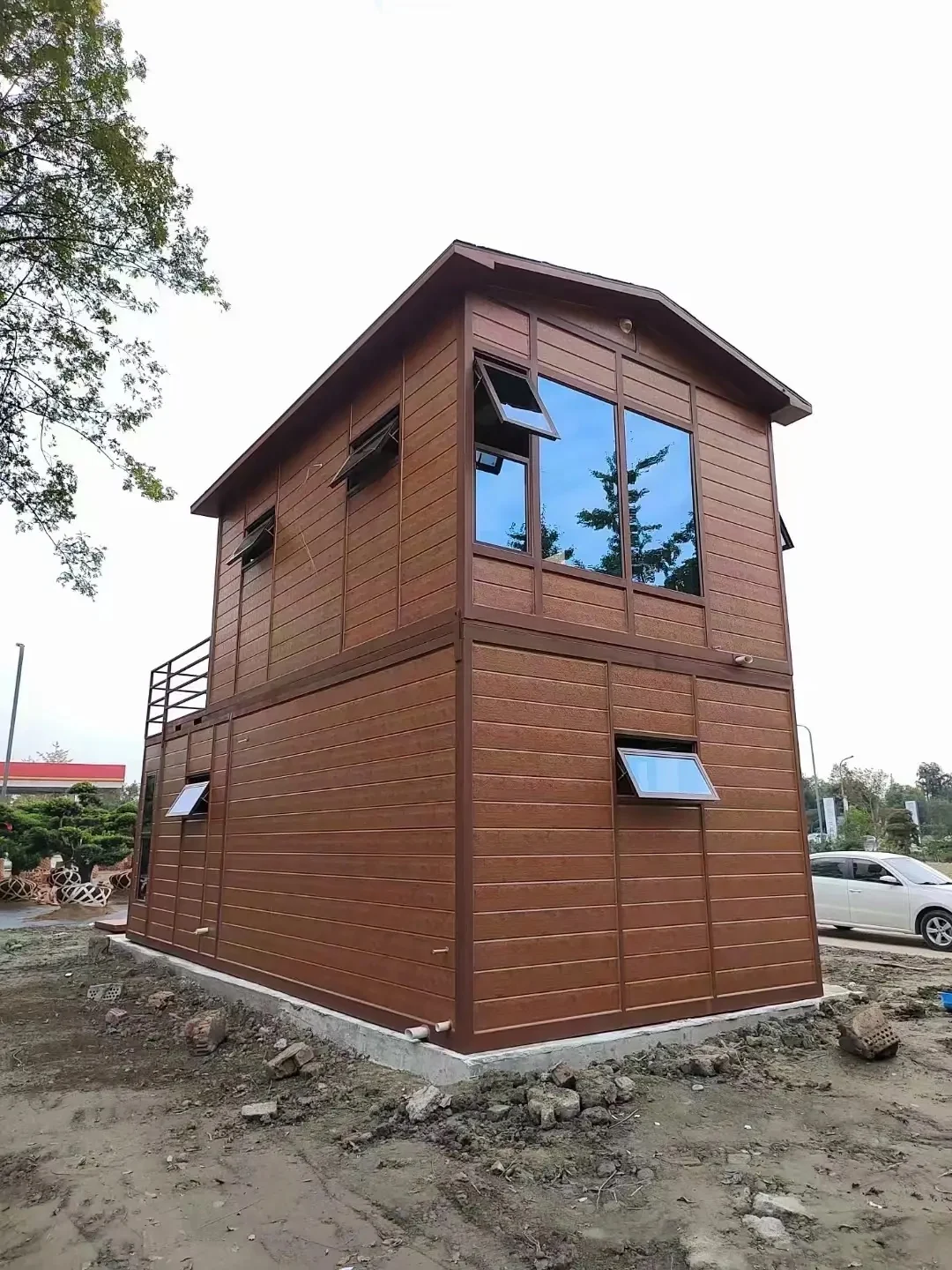 Wood finish exterior panels on a compact two storey kiosk